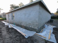 IMG 1720  We are waterproofing 42 ft along the north garage wall where the driveway will be poured and about 12 ft down the west wall.