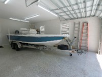 IMG 2597  I waited 7 days after installing the epoxy floor before finally moved the boat into the garage.  It fits with 2 ft to spare in the front.