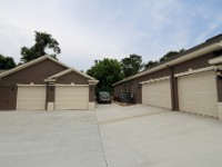 IMG 2771  Aug 8 2015 -- After being delayed for about a month because of so much rain we finally got all four garage doors and the west wall of the detached garage repainted with the lighter trim color. Hopefully this will help keep it a little cooler in the garages (along with the insulated garage doors).