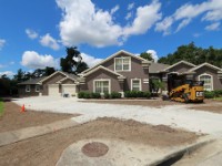 IMG 2782  August 19 2015 - Landscapers are working on the landscaping and laying new sod around the house and detached garage.